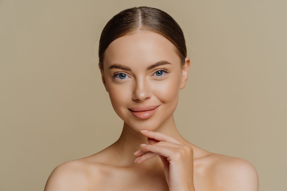 A woman with blue eyes posing for the camera.